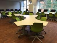 Modular tables and chairs in 312 Denney Hall