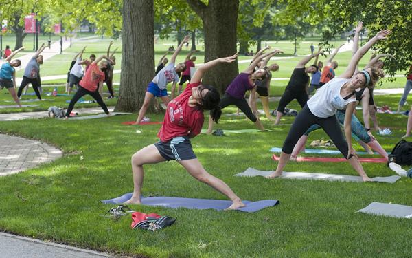 Group of people doing outdoor yoga