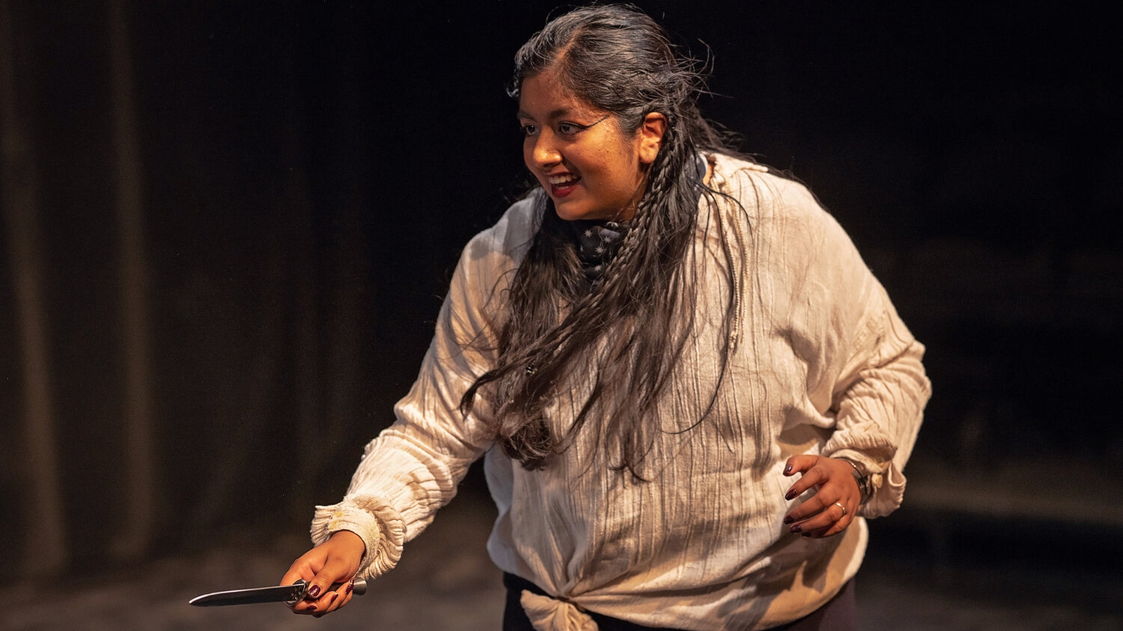 Actor brandishing knife in Romeo and Juliet