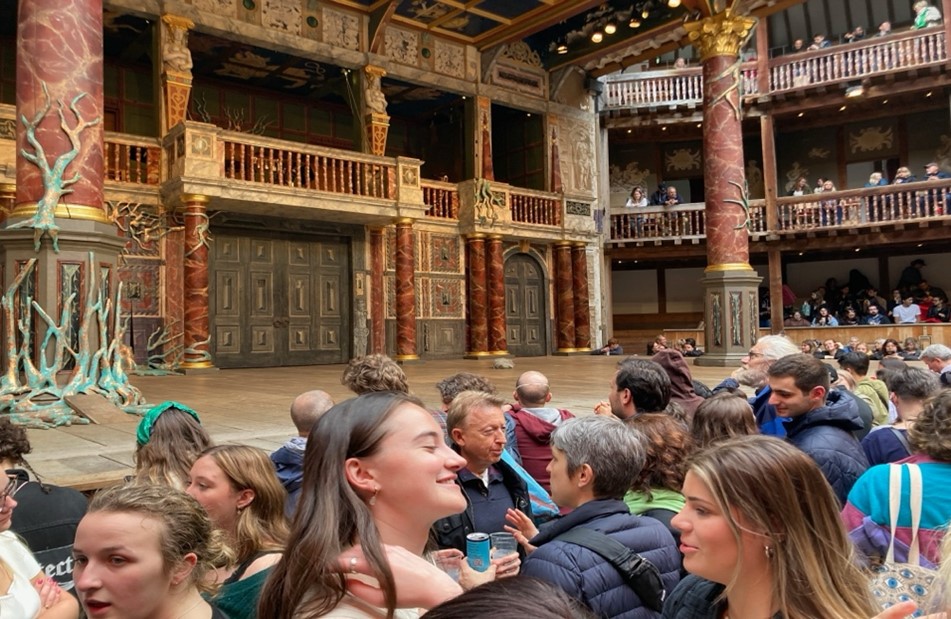 Crowd watching a play at the Globe