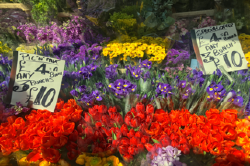 Photograph of flowers for sale at a street market
