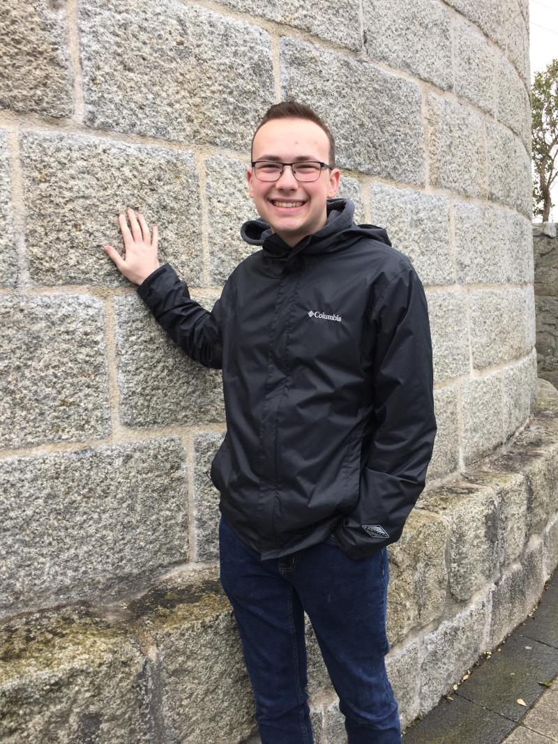 Vince Bella in front of a brick wall