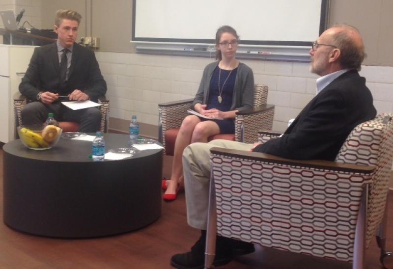 Rand being interviewed by students Emily Berestecky and Trent Lammers
