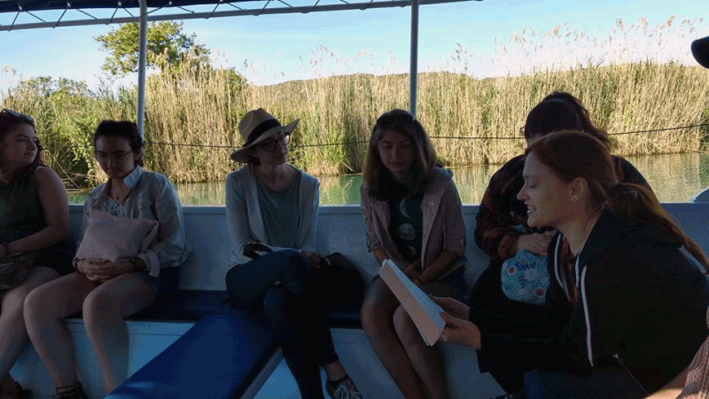 Reading The Odyssey in Greece Literary Locations class reading The Odyssey on a bus in Greece