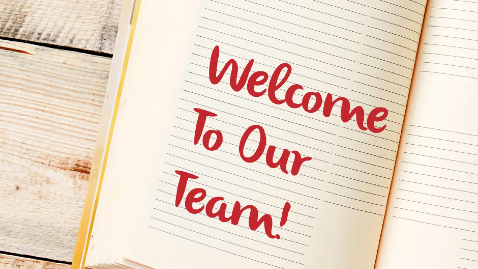 Book with the words welcome to our team on the book's page
