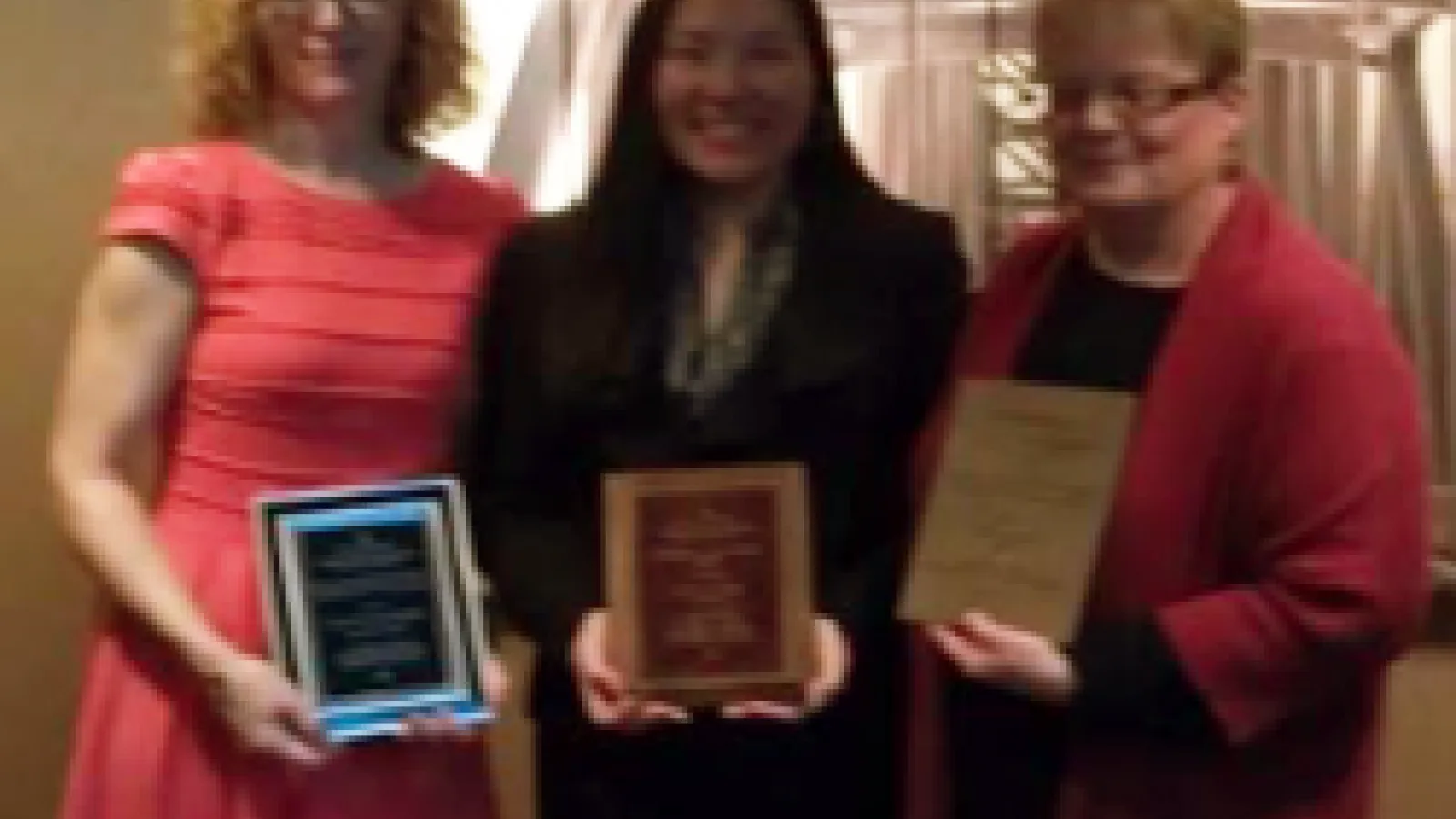 Photo of Renker, Itagaki and Johnson with their awards