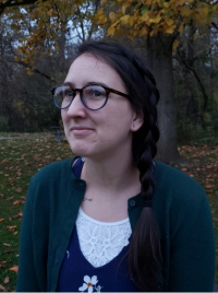 Photograph of student Brittany Halley standing in front of a tree