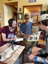 Two students interview a person 