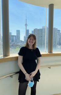 Molly Teller in front of city skyline