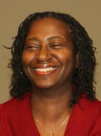 Professional headshot in which Associate Professor Beverly Moss poses, smiling