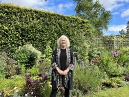 Robyn Warhol in a garden