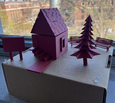 3D printed red cabin and trees