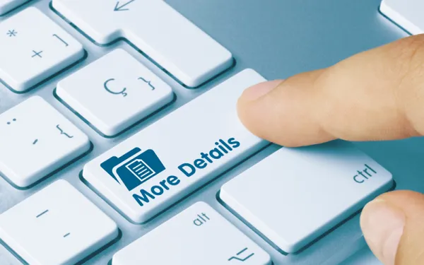 A finger pressing a button labeled "More Details"