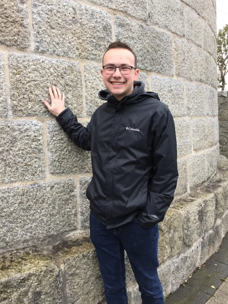 Vince Bella in front of a brick wall