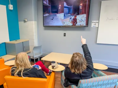 Department staff members play It Takes Two on the Xbox Series X