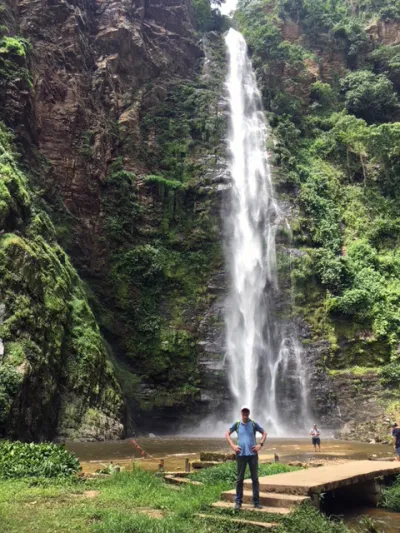 Eddie Singleton stands in front of the Wli Waterfalls in the Volta Region of Ghana