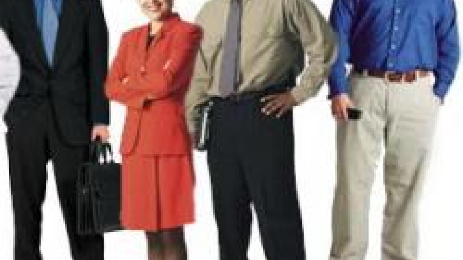 Four people in professional clothings in front of a white background