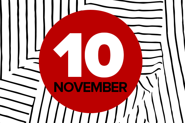 November 10 written in white text on red circle with black vertical and horizontal lines 