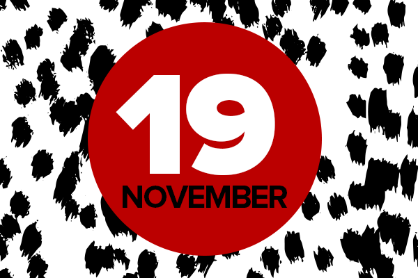 Red circle with 19 November written on it, on a white background with black dots