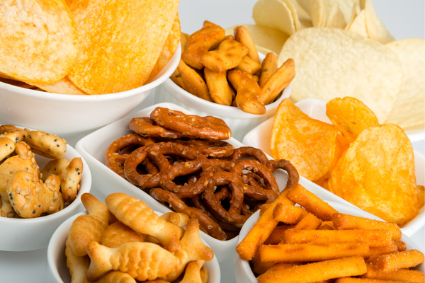 Assorted snacks such as chips and pretzels.
