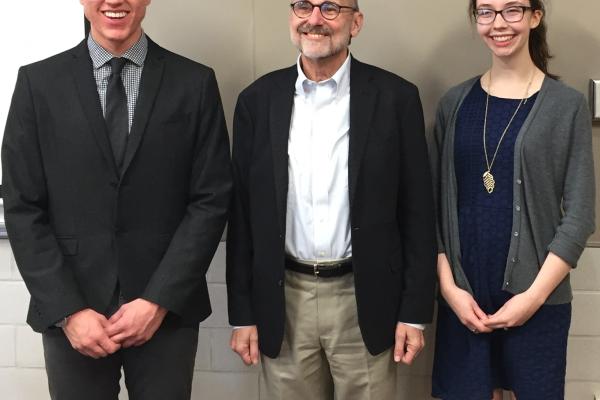 Rand Morrison standing with students Emily Berestecky and Trent Lammers